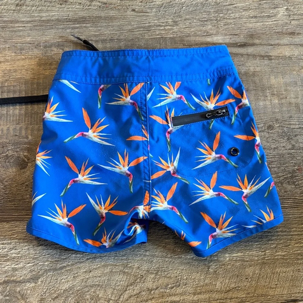 Vibrant Blue Kids‎ Swim Trunks with Tropical Print